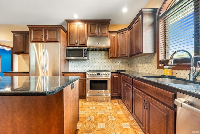 2395 S 400 St W, Warsaw, IN 46580 - kitchen with appliances with stainless steel finishes, ventilation hood, a sink, backsplash, and dark stone counters