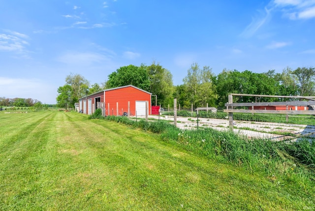 2395 S 400 St W, Warsaw, IN 46580 - view of yard with a garage, driveway, an outbuilding, and a pole building