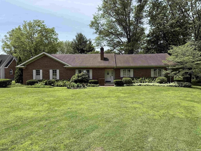 2807 Avondale Rd, Vincennes, IN 47591 - ranch-style house with a front yard, brick siding, and a chimney