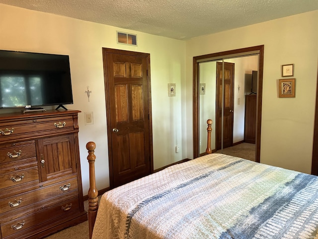 2807 Avondale Rd, Vincennes, IN 47591 - carpeted bedroom featuring a closet, baseboards, and a textured ceiling
