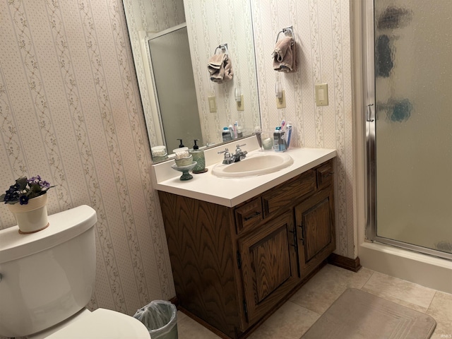 2807 Avondale Rd, Vincennes, IN 47591 - bathroom with wallpapered walls, vanity, a shower stall, toilet, and tile patterned flooring