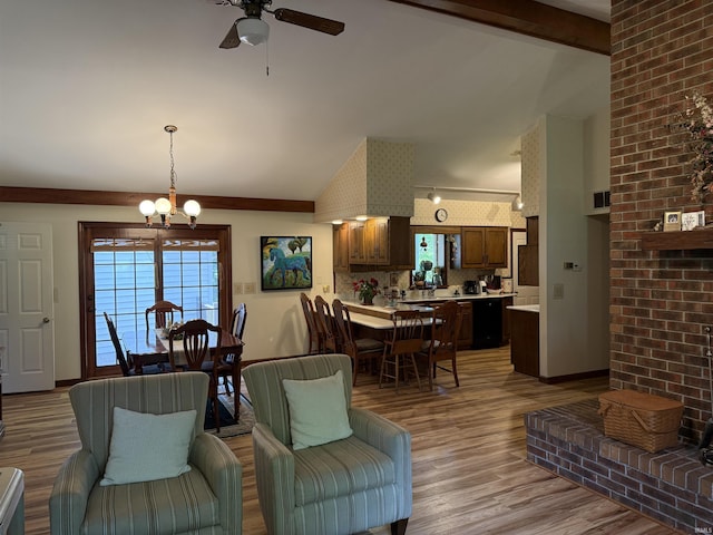 2807 Avondale Rd, Vincennes, IN 47591 - living area featuring vaulted ceiling, ceiling fan, a chandelier, and light wood finished floors
