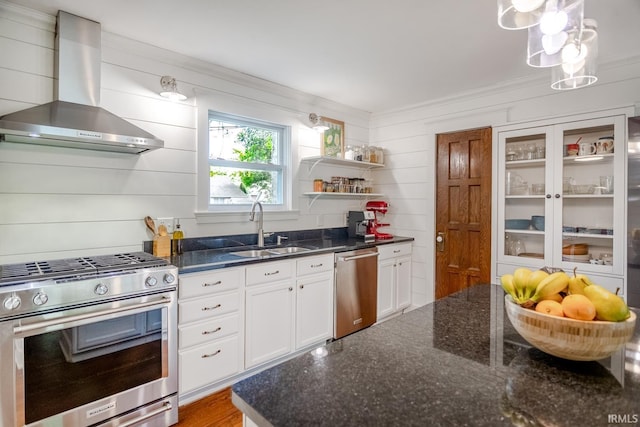 704 Avondale St, West Lafayette, IN 47906 - kitchen with wall chimney exhaust hood, appliances with stainless steel finishes, a sink, white cabinets, and dark stone countertops