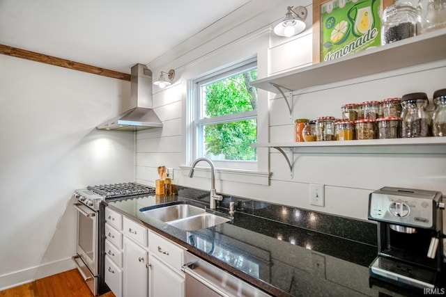 704 Avondale St, West Lafayette, IN 47906 - kitchen with stainless steel appliances, wall chimney range hood, a sink, white cabinets, and open shelves