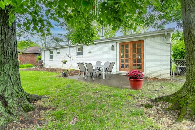 704 Avondale St, West Lafayette, IN 47906 - rear view of property featuring brick siding and a patio area