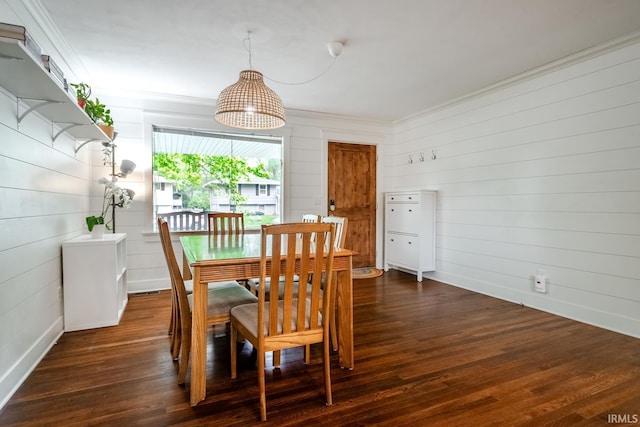 704 Avondale St, West Lafayette, IN 47906 - dining space with ornamental molding, dark wood-type flooring, wood walls, and baseboards