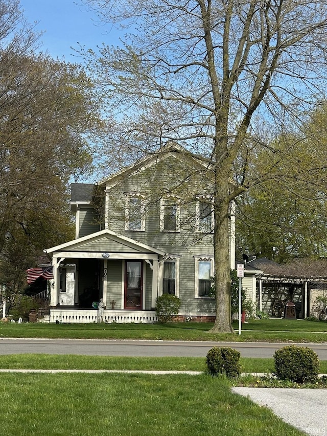 702 S Van Buren St, Auburn, IN 46706 - view of front facade with a front yard and a porch