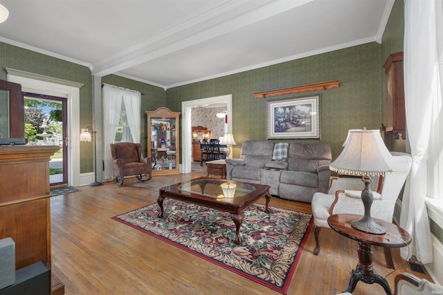 702 S Van Buren St, Auburn, IN 46706 - living room featuring wood finished floors, crown molding, and wallpapered walls