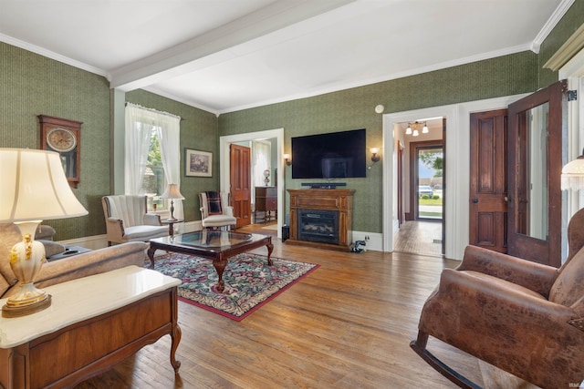 702 S Van Buren St, Auburn, IN 46706 - living room with wallpapered walls, wood finished floors, crown molding, and a fireplace