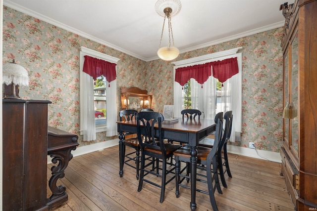 702 S Van Buren St, Auburn, IN 46706 - dining space featuring hardwood / wood-style flooring, crown molding, and baseboards