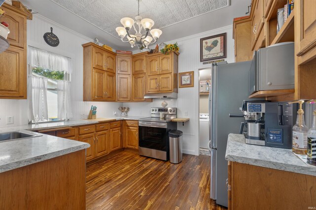 702 S Van Buren St, Auburn, IN 46706 - kitchen with appliances with stainless steel finishes, under cabinet range hood, a chandelier, dark wood finished floors, and light countertops