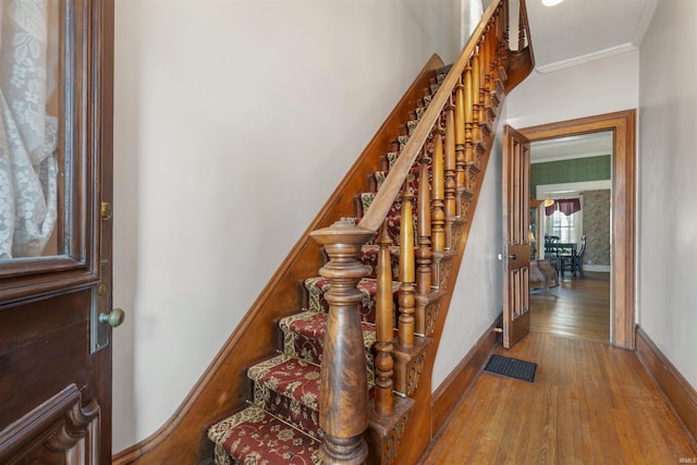 702 S Van Buren St, Auburn, IN 46706 - staircase featuring ornamental molding, wood finished floors, and baseboards