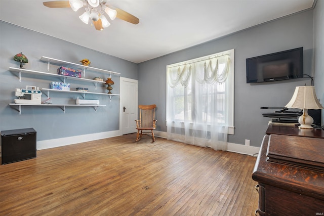 702 S Van Buren St, Auburn, IN 46706 - home office featuring ceiling fan, hardwood / wood-style flooring, and baseboards