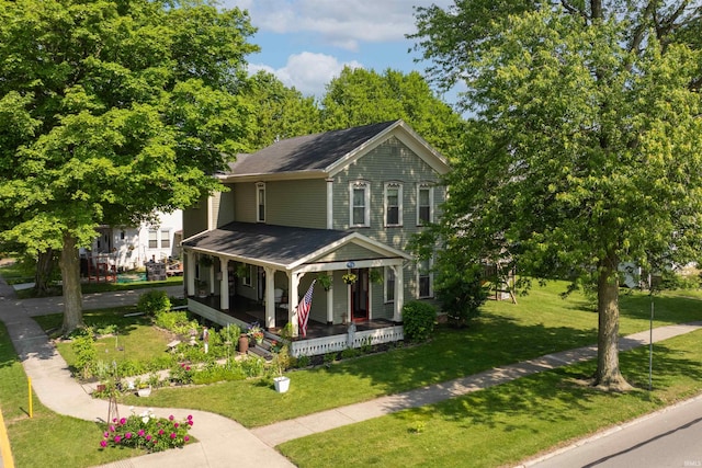 702 S Van Buren St, Auburn, IN 46706 - view of front of property with covered porch, a front yard, and roof with shingles
