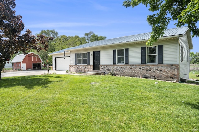 16105 County Road 22, Goshen, IN 46528 - ranch-style house with brick siding, an attached garage, concrete driveway, a front lawn, and a barn