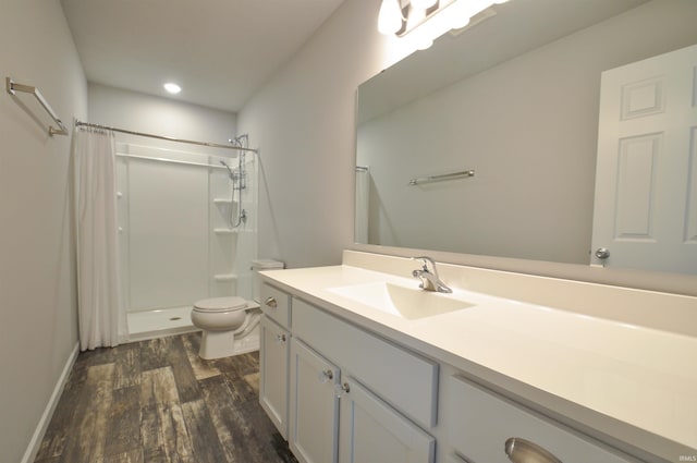 409 W Somerfield Dr, Lakeville, IN 46536 - full bath with wood finished floors, vanity, toilet, a shower with shower curtain, and recessed lighting