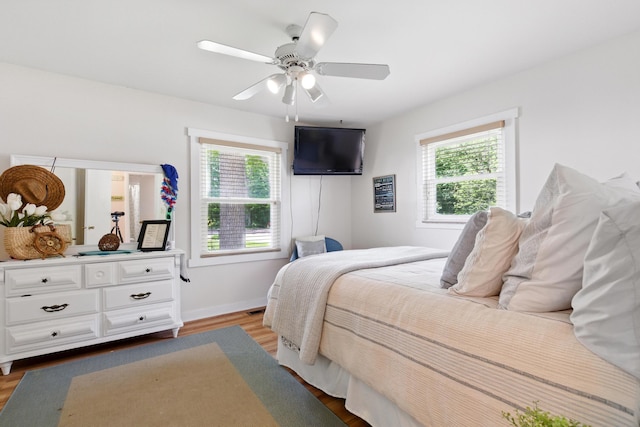 5585 S 930 E, Wolcottville, IN 46795 - bedroom featuring light wood finished floors, ceiling fan, and baseboards