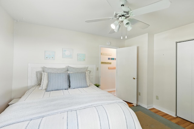 5585 S 930 E, Wolcottville, IN 46795 - bedroom featuring light wood finished floors, baseboards, and a ceiling fan