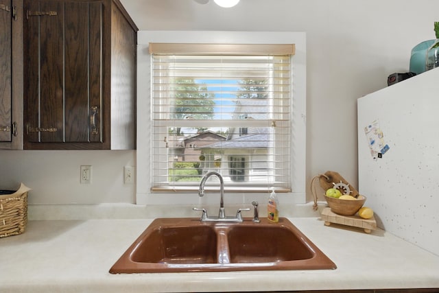 5585 S 930 E, Wolcottville, IN 46795 - kitchen with a sink, dark brown cabinetry, and light countertops