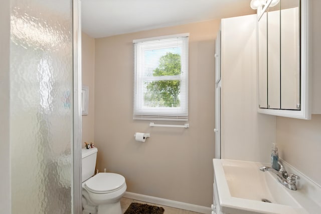 5585 S 930 E, Wolcottville, IN 46795 - bathroom featuring toilet, vanity, baseboards, a shower, and tile patterned flooring