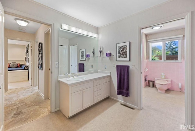 570 Golden Pl, Lafayette, IN 47905 - bathroom featuring vanity, toilet, and baseboards