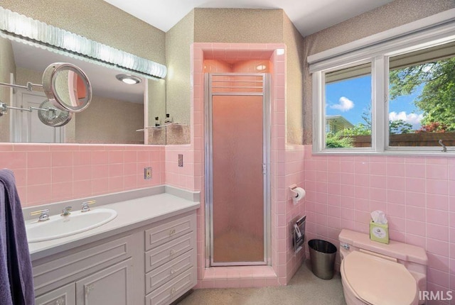570 Golden Pl, Lafayette, IN 47905 - full bath featuring tile walls, a stall shower, vanity, and toilet