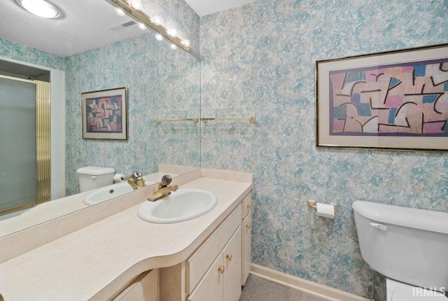 570 Golden Pl, Lafayette, IN 47905 - bathroom featuring toilet, baseboards, vanity, a shower stall, and wallpapered walls