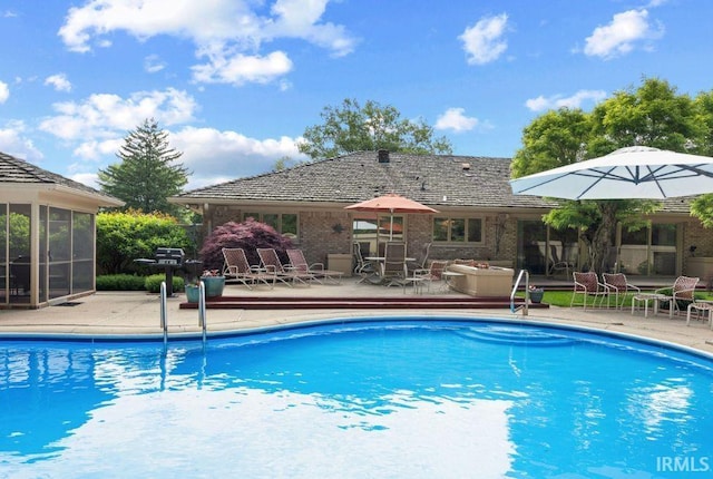 570 Golden Pl, Lafayette, IN 47905 - outdoor pool featuring a sunroom, a patio area, and a grill
