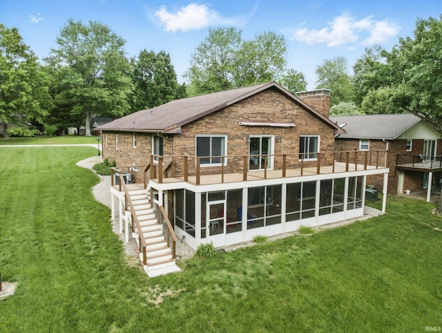 951 W Shepherds Ln, Santa Claus, IN 47579 - back of house with stairs, a sunroom, a lawn, brick siding, and a wooden deck