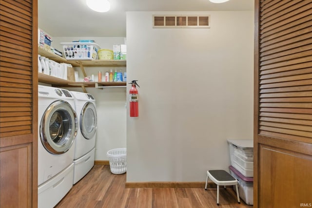 951 W Shepherds Ln, Santa Claus, IN 47579 - washroom with independent washer and dryer, light wood-type flooring, and baseboards