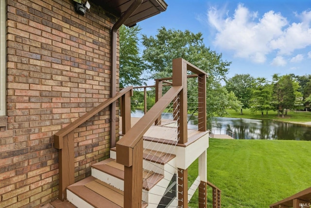951 W Shepherds Ln, Santa Claus, IN 47579 - wooden deck with a water view, stairway, and a lawn