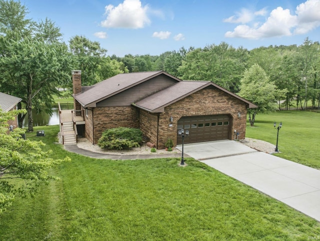 951 W Shepherds Ln, Santa Claus, IN 47579 - view of front of house with a garage, brick siding, a chimney, driveway, and a front yard