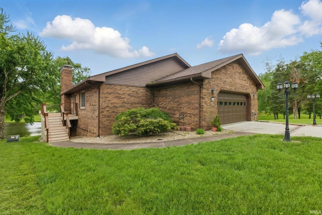 951 W Shepherds Ln, Santa Claus, IN 47579 - view of property exterior featuring a chimney, a garage, concrete driveway, brick siding, and a yard