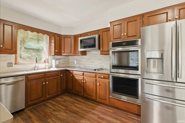 951 W Shepherds Ln, Santa Claus, IN 47579 - kitchen featuring stainless steel appliances, brown cabinets, light countertops, and decorative backsplash