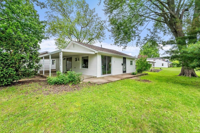 730 E Sherman St, Marion, IN 46952 - rear view of property featuring a yard and a patio