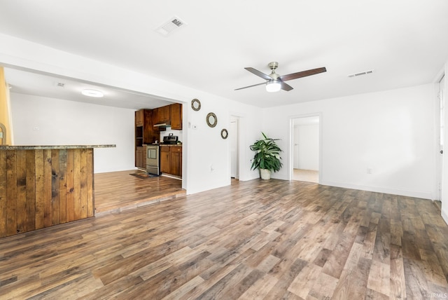 730 E Sherman St, Marion, IN 46952 - unfurnished living room featuring ceiling fan and wood finished floors