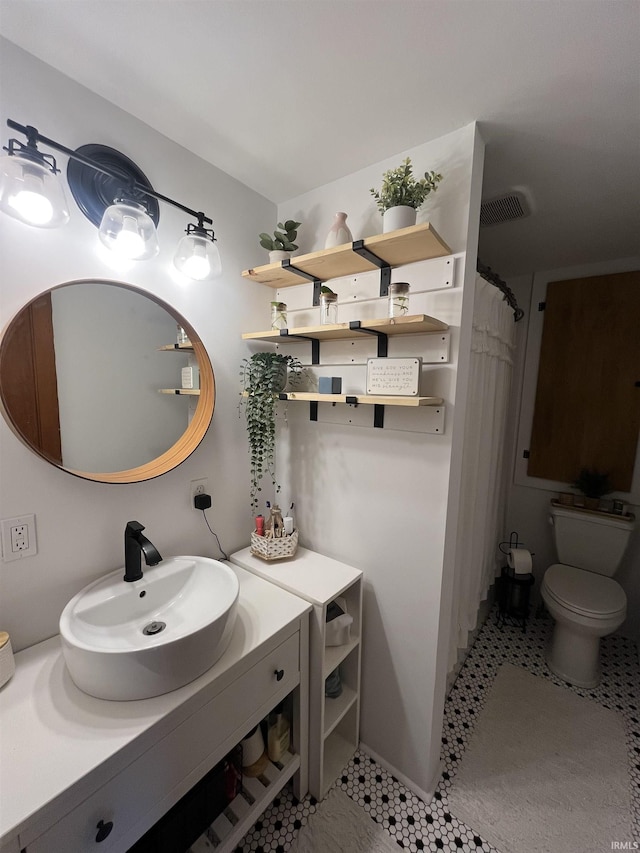 375 E Harrison Ave, Wabash, IN 46992 - full bath with toilet, vanity, tile patterned floors, and curtained shower