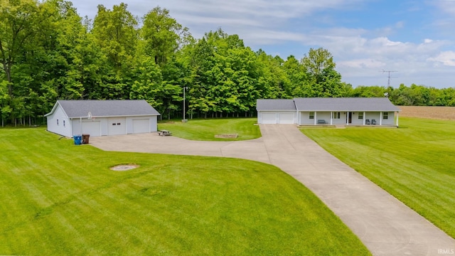 11542 S 700 E, Lafontaine, IN 46940 - view of front facade with an outbuilding, a front lawn, a garage, a porch, and view of scattered trees