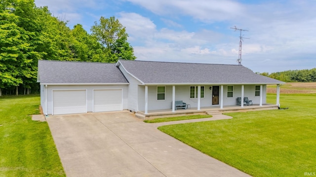 11542 S 700 E, Lafontaine, IN 46940 - view of front facade with a porch, a garage, concrete driveway, a front lawn, and roof with shingles