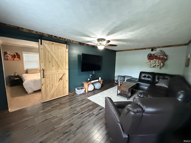 2782 W State Road 32nd Rd, Covington, IN 47932 - living area featuring a barn door, ceiling fan, dark wood finished floors, and crown molding