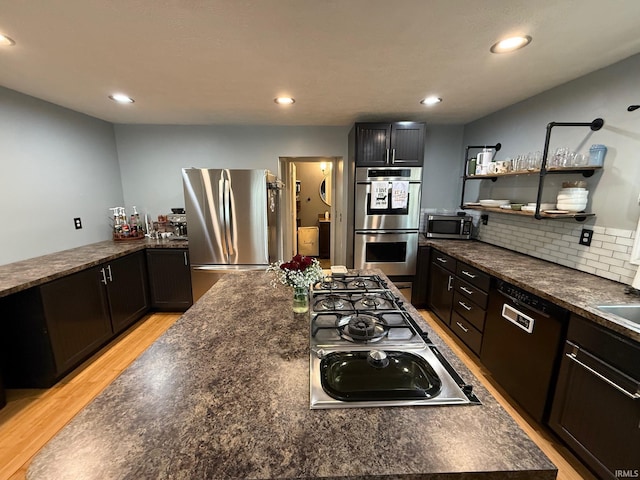 2782 W State Road 32nd Rd, Covington, IN 47932 - kitchen with appliances with stainless steel finishes, light wood-style flooring, recessed lighting, a center island, and open shelves