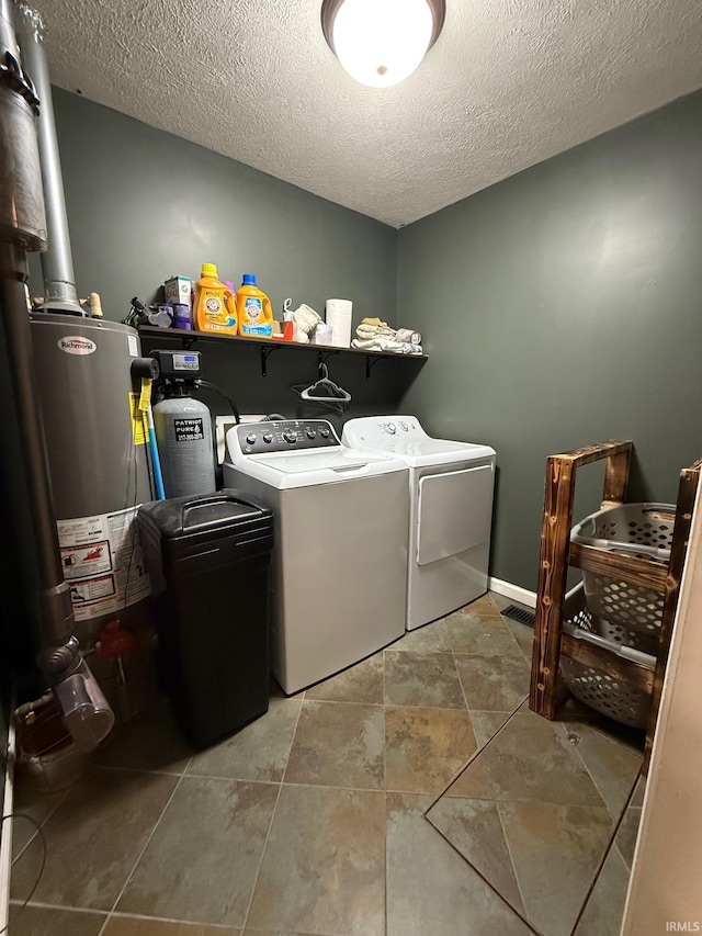 2782 W State Road 32nd Rd, Covington, IN 47932 - laundry room featuring washing machine and clothes dryer and a textured ceiling