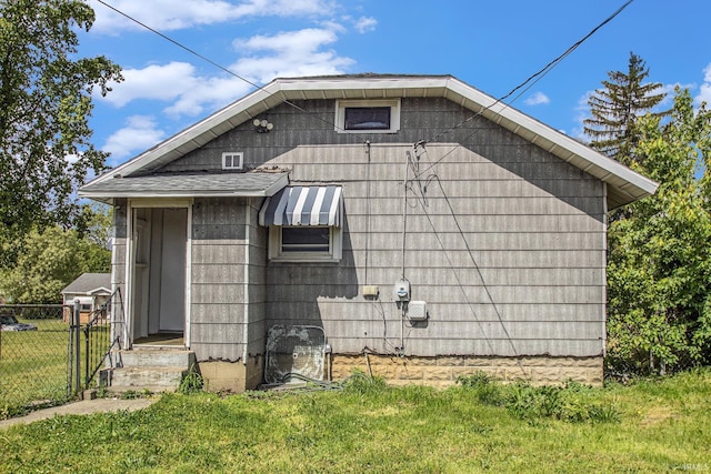 1130 N Kentucky St, South Bend, IN 46628 - view of property exterior featuring roof with shingles