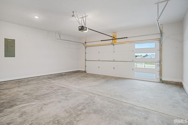 2487 Fiona Dr, Kokomo, IN 46902 - garage with a garage door opener, electric panel, and baseboards