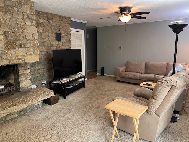 405 N Dogwood Ln, Muncie, IN 47304 - living room with crown molding, ceiling fan, carpet, a textured ceiling, and a stone fireplace