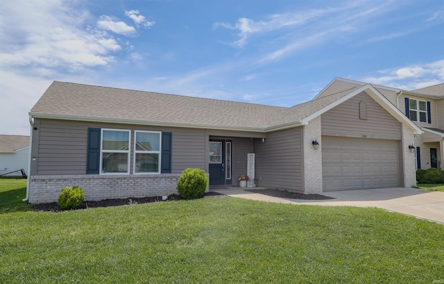 2141 Rutherford Dr, West Lafayette, IN 47906 - view of front of property with brick siding, an attached garage, concrete driveway, and a front lawn
