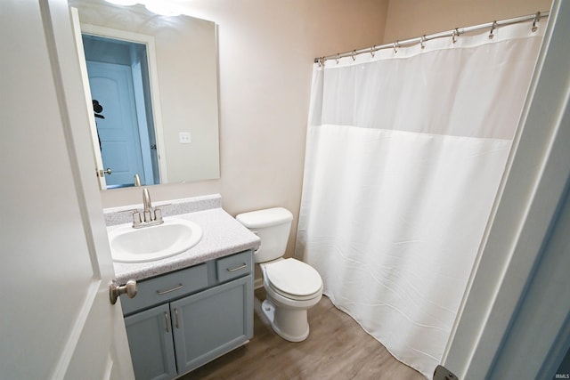 2141 Rutherford Dr, West Lafayette, IN 47906 - full bath featuring toilet, vanity, wood finished floors, and curtained shower