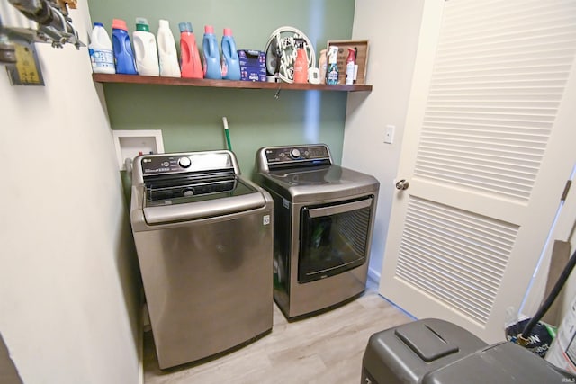 2141 Rutherford Dr, West Lafayette, IN 47906 - laundry area with washing machine and dryer and light wood-type flooring