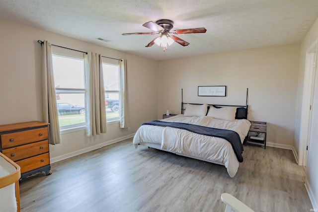 2141 Rutherford Dr, West Lafayette, IN 47906 - bedroom with light wood-type flooring, baseboards, and ceiling fan