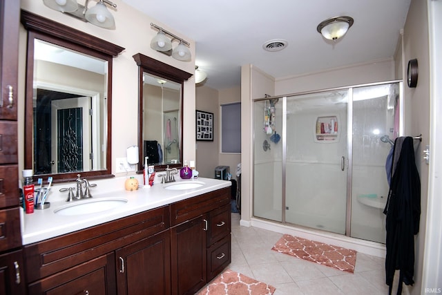 101 Hendron Hills Dr, Vincennes, IN 47591 - full bathroom featuring a stall shower, double vanity, and tile patterned flooring